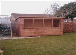 The same long timber building from the other end