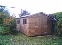 A long apex shed with windows along one side