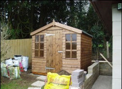A square timber shed
