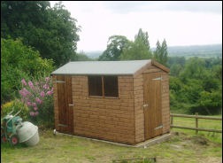 A timber shed with a window beside the door