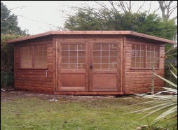 A corner shed fitted into the angle of a garden