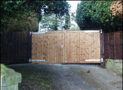 A ledged and braced timber door in a stone arch