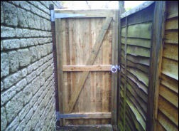 A tall timber side gate