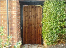 A pair of close-boarded gates across a drive