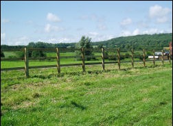Post and rail along a field edge