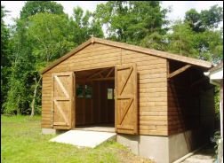 A 20 by 10 timber workshop with a ramp and double doors