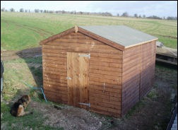 A timber shed with a window