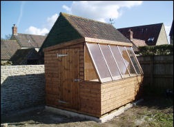 A potting shed with a glazed sloping front