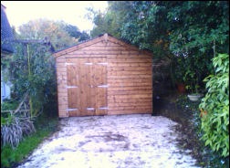 A timber garage from the side