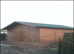 A timber garage with a window