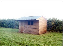 A timber loose box with a stable door