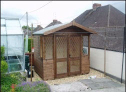 A 9 by 8 summer house with diamond-lattice windows