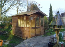 The 9 by 9 summer house with its doors open