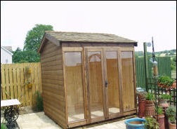 A summer house in a garden corner